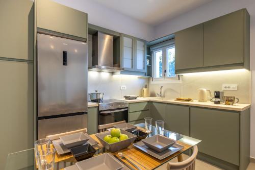 a kitchen with a table with a bowl of fruit on it at Allegro Apartment 2 in Lakithra