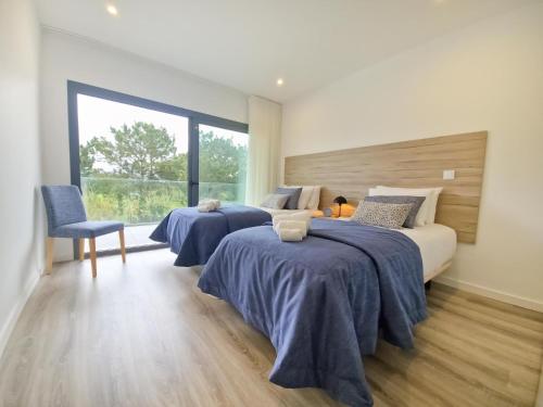 Giường trong phòng chung tại Sunset Waves Nazare - BY SCH