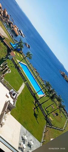 an aerial view of a resort by the water at Hotel Norat Palmeira Playa in Ribeira