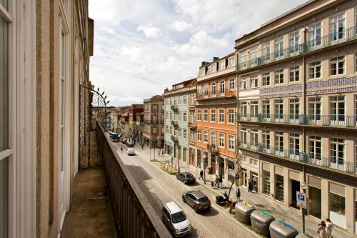 a view of a city street with parked cars and buildings at RVA - Porto Central Flats in Porto