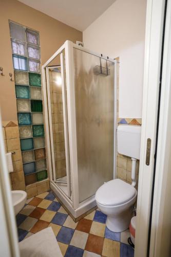 a bathroom with a toilet and a shower in it at Antica Dimora in Palermo