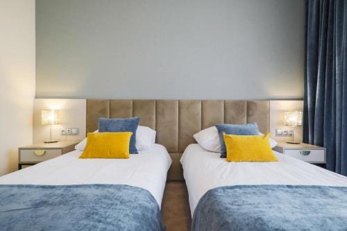 Pałac w Konarach Resort SPA & Conferenceにあるベッド