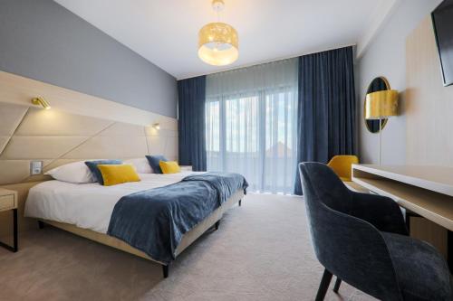 Pałac w Konarach Resort SPA & Conferenceにあるベッド