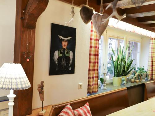 a room with a picture of a man on the wall at Pension Ferienwohnung Baarblick in Donaueschingen