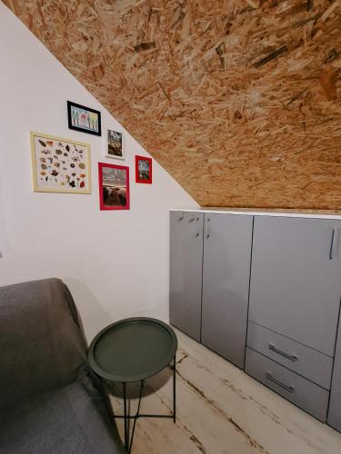 a living room with a couch and a table at Cudnie tu - Borsk in Borsk