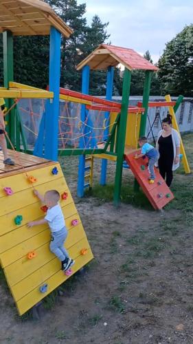 a group of children playing on a playground at Vila Dzavric in Zlatibor