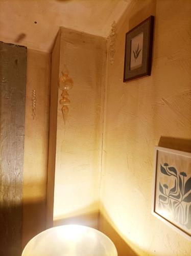 a bathroom with a toilet and a picture on the wall at Home4U Κερατέα apt4, just 17km from airport in Keratea