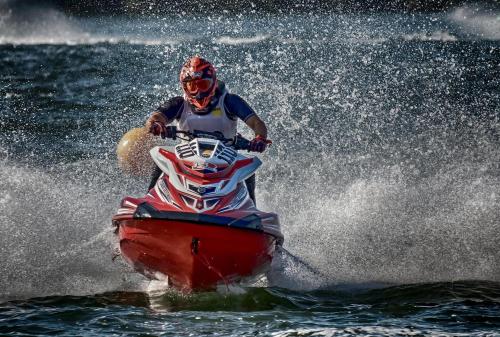 a man riding a jet ski in the water at FulleRulle in Båtskärsnäs