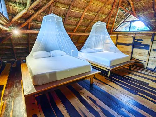 Postel nebo postele na pokoji v ubytování Treehouse Tulum H2Ojos