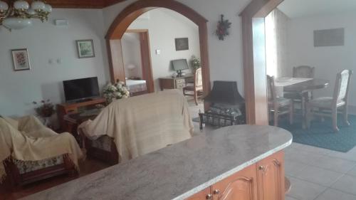 a living room with a table and a living room with a dining room at Villa Segetski dvori - Tradition since 1964 in Trogir