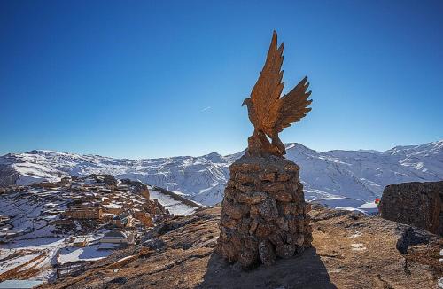 a statue of an eagle on top of a mountain at Aden Luxury Villas Quba in Quba