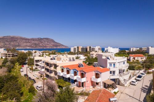 an aerial view of a city with buildings at Iliada Studios in Karpathos Town