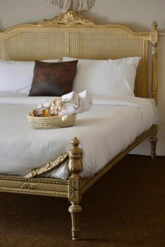 a bedroom with a bed with a basket on it at 430 Guest House Residential Hotel in Islamabad