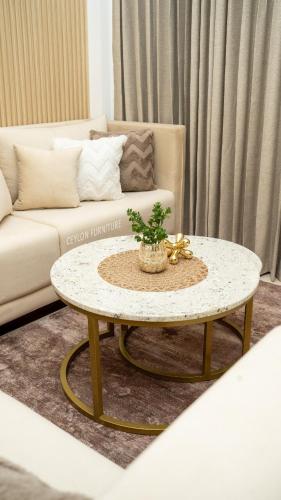 a living room with a coffee table and a couch at Spacious 3BR Luxury Apartment Trizen Colombo 2 Near City Centre in Colombo