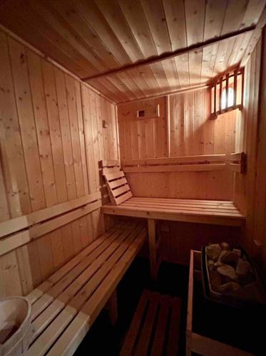 an empty wooden sauna with a bench in it at Unique, High-Design 6 Bedrooms Chalet in Villars Centre in Ollon