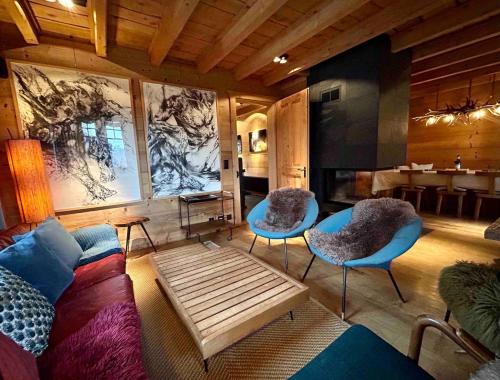 a living room with a couch and two chairs at Unique, High-Design 6 Bedrooms Chalet in Villars Centre in Ollon