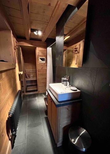 a small bathroom with a sink and a toilet at Unique, High-Design 6 Bedrooms Chalet in Villars Centre in Ollon