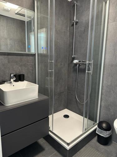 a bathroom with a shower and a sink at Levdream in Leverkusen