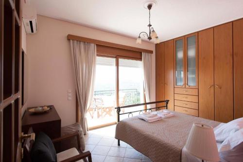 Ένα ή περισσότερα κρεβάτια σε δωμάτιο στο Tragana Villa