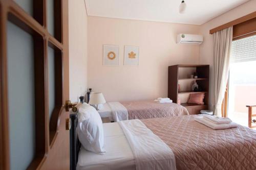 Ένα ή περισσότερα κρεβάτια σε δωμάτιο στο Tragana Villa