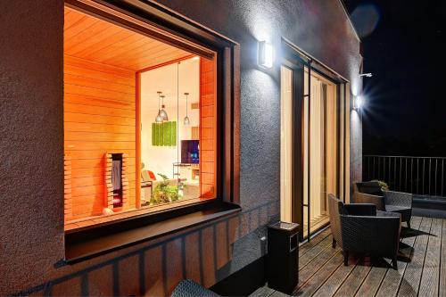 a room with a window and a table and chairs at Wellness Hotel Fénix in Liberec