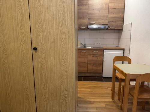 a kitchen with a table and a dining room at Fichtenzauber in St. Blasien