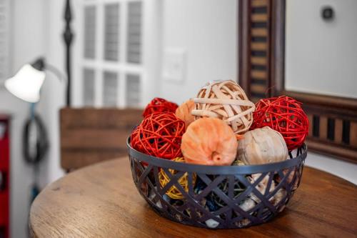 a basket of yarn sitting on top of a table at The Clubhouse Hideaway - The Greenview Den in Chapel Hill