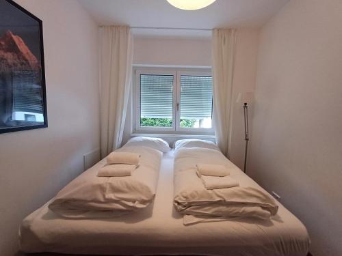 Postel nebo postele na pokoji v ubytování Falcon Lodge Kaprun Kitzsteinhorn - Steinbock Lodges
