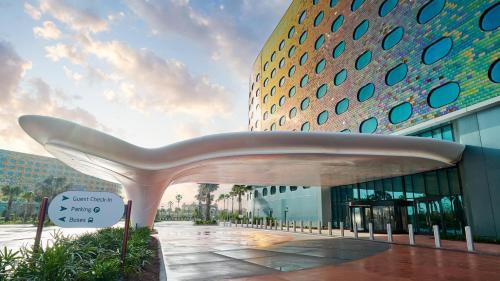 a white bench in front of a building at Universal's Terra Luna Resort in Orlando