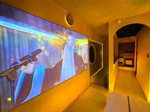 TV a/nebo společenská místnost v ubytování 龙湖高新天街店Loft房