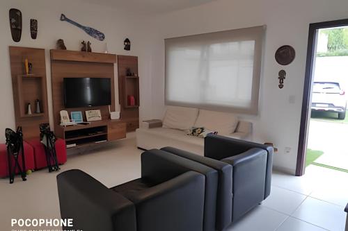 TV a/nebo společenská místnost v ubytování Casa de condomínio em Maresias - SP (7)