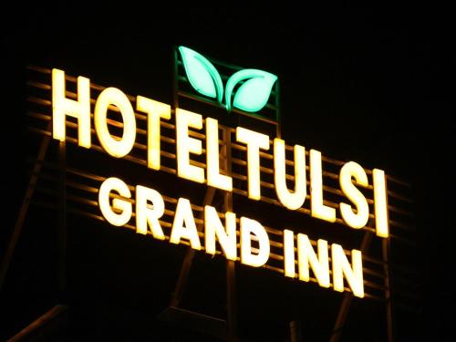 a sign that reads hotel trusts grand inn at Hotel Tulsi Grand inn in Vrindāvan