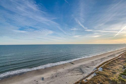 an aerial view of a beach with the ocean at Oceanfront TOP LOCATION MODERN RESORT Lazy River Huge Pool Oasis in Myrtle Beach