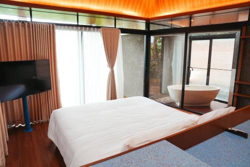 Katil atau katil-katil dalam bilik di Tanawana Borobudur Living