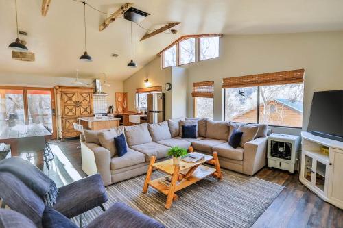 a living room with a couch and a table at The Blue Jay at Zen Zion in Glendale