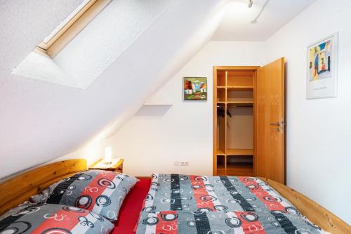 a bedroom with a bed in a attic at Drei Tannen in Todtnau