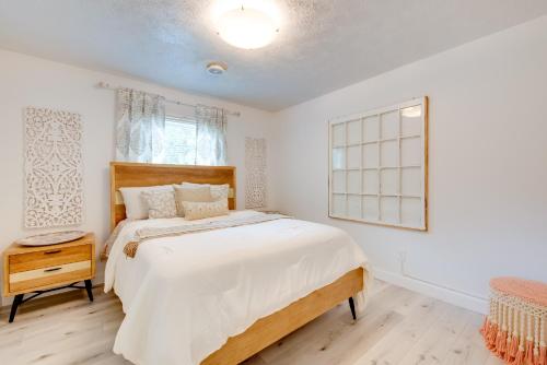 a bedroom with a large bed and a window at Mableton Home with Private Pool about 15 Mi to ATL! in Mableton