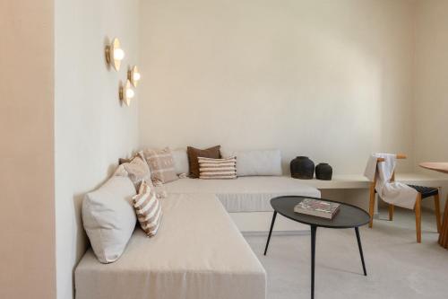 a living room with a couch and a table at Surupo Suites in Imerovigli