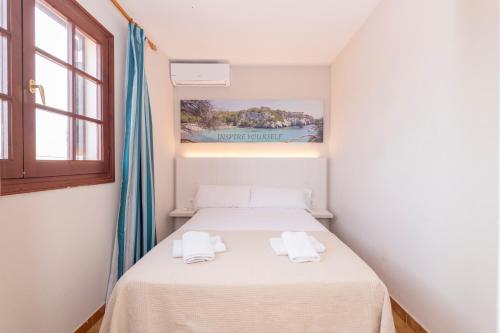 Ένα ή περισσότερα κρεβάτια σε δωμάτιο στο Siesta Mar One Bedroom Apartments