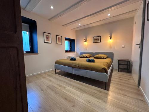 a bedroom with a bed in a room at B'm Hans - Centre Historique - Vue Cathédrale - 2P in Colmar