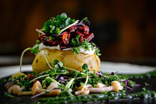 a pile of food sitting on top of a table at Das ACKER Hotel in Neuburg an der Donau