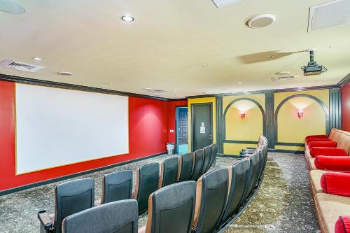 an empty room with chairs and a blank screen at Diamond Beach Resort - Lazy River View #419 in Galveston