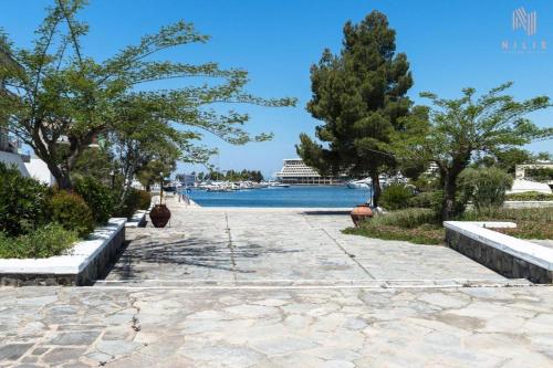 a walkway with a view of the water at Porto Karras Private Rental, Nilie Hospitality MGMT in Neos Marmaras