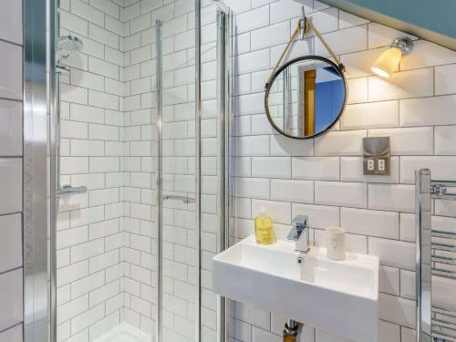 a bathroom with a sink and a shower at 3 Bed in New Quay 83998 in New Quay