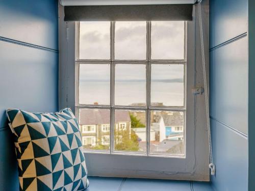 a window in a room with a pillow at 3 Bed in New Quay 83998 in New Quay