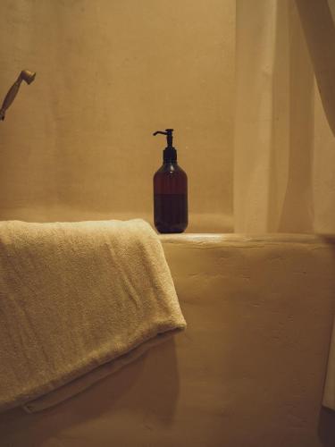a bathroom with a soap dispenser sitting on a ledge at Casa Nutabe - Casa de Campo en Girardota cerca a Medellín in Girardota