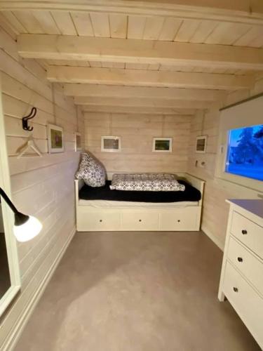 a room with a bed in a small room at Offroadcamp in Sörsjön