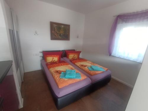 Ένα ή περισσότερα κρεβάτια σε δωμάτιο στο Ferienwohnung an der Brauerei