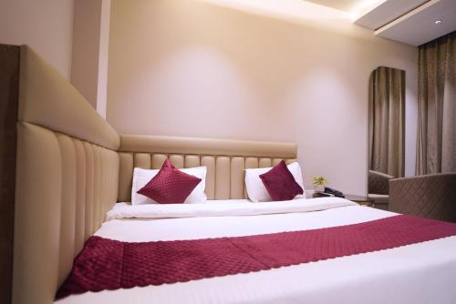 Hotel Siya Ramayaにあるベッド