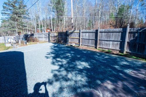 a shadow of a dog on a driveway at Chic Catskills Farmhouse in Harris